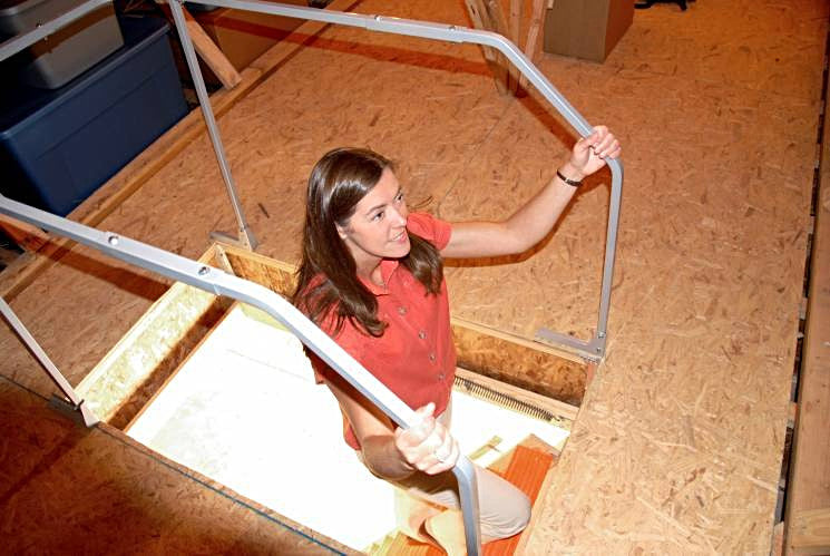 VERSA RAIL MODEL 60 ATTIC LADDER SAFETY RAIL with girl coming up