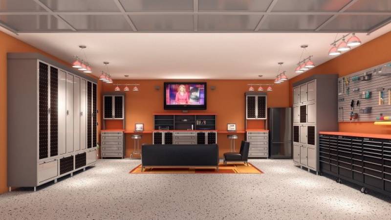 Modern and very clean garage with TV, seating area and lots of storage. 