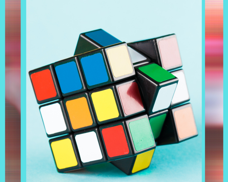 sign that says The Answer with cube