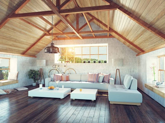 Interior of a modern looking living room, exposed beams and wooden floors