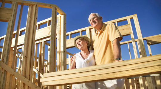 couple looking at framing of house