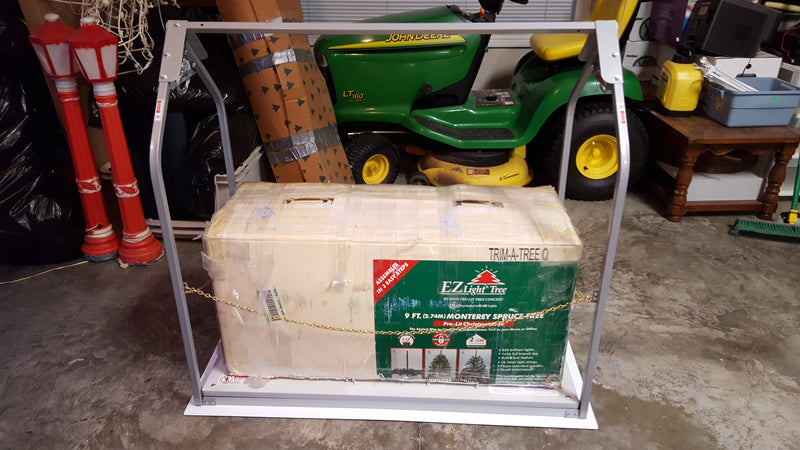 Container with a green label on a metal stand in an indoor setting